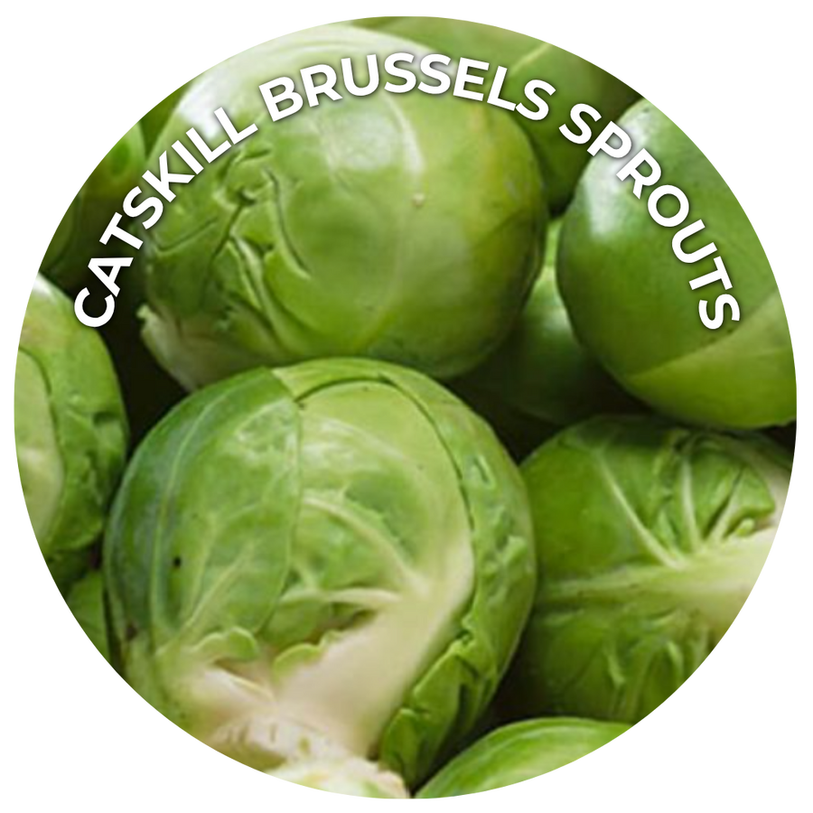 Green brussels sprouts stacked on top of each other. 